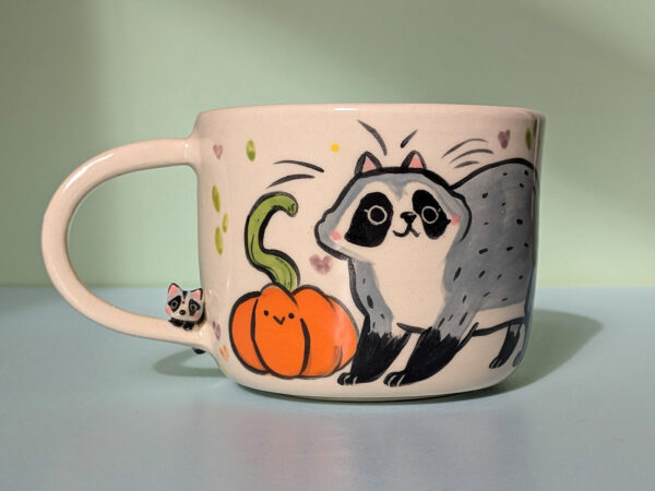 handmade pumpkin and raccoon mug