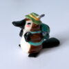 adorable platypus figurine with a backpack and feathered hat