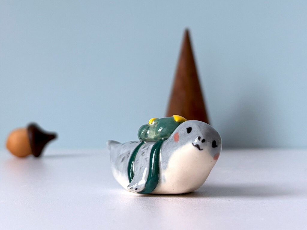 cutest seal figurine with a backpack, handmade porcelain collectible piece