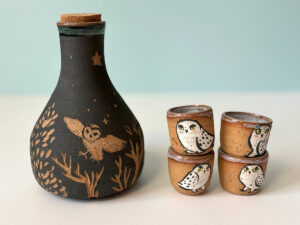 pretty ceramic sake set with 4 shots and decorated with owls