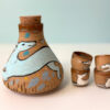 pretty cool ceramic sake set, handamde and illustrated with sight hounds