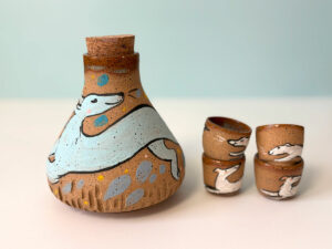 pretty cool ceramic sake set, handamde and illustrated with sight hounds